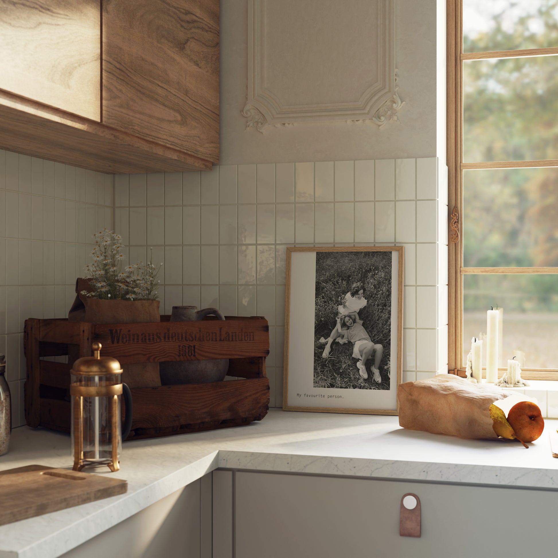 Aballone Studios Custom Photo Print featuring large offset image of 2 girls in black and white. Print is framed and lent against the wall in white tiles and wood kitchen